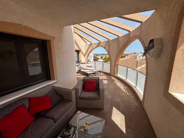 Single-Storey House with Covered Arched Terrace and Walled Tiled Courtyard