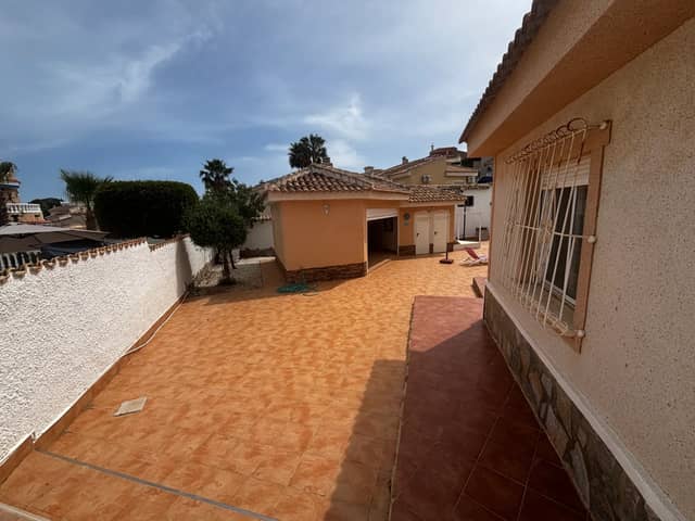 Single-Storey House with Covered Arched Terrace and Walled Tiled Courtyard